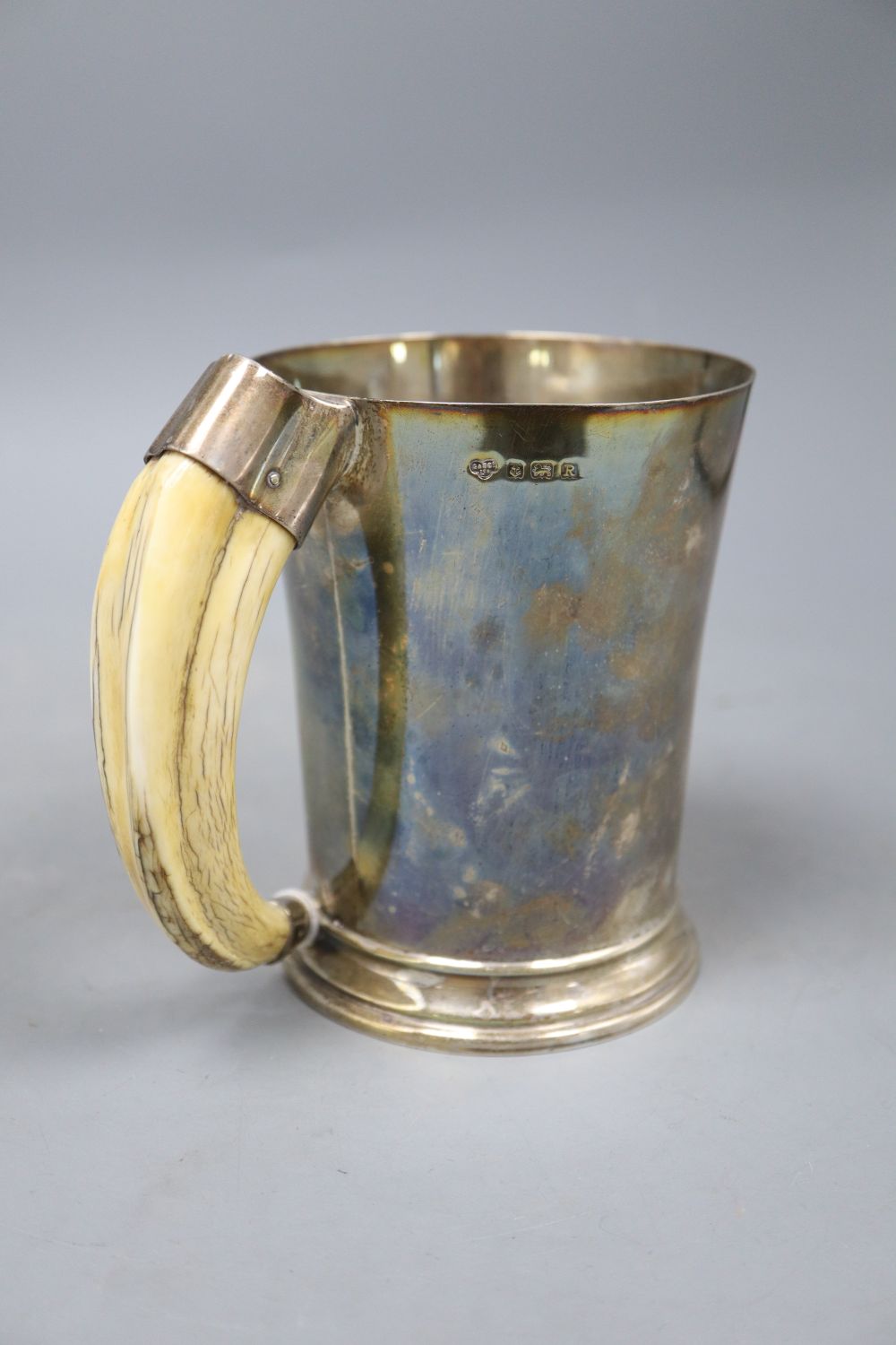 A George VI silver mug with boars tusk handle, Goldsmiths & Silversmiths Co Ltd, Birmingham, 1941,